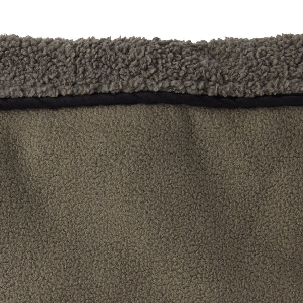 Close-up of a textured brown carpet with a visible border.