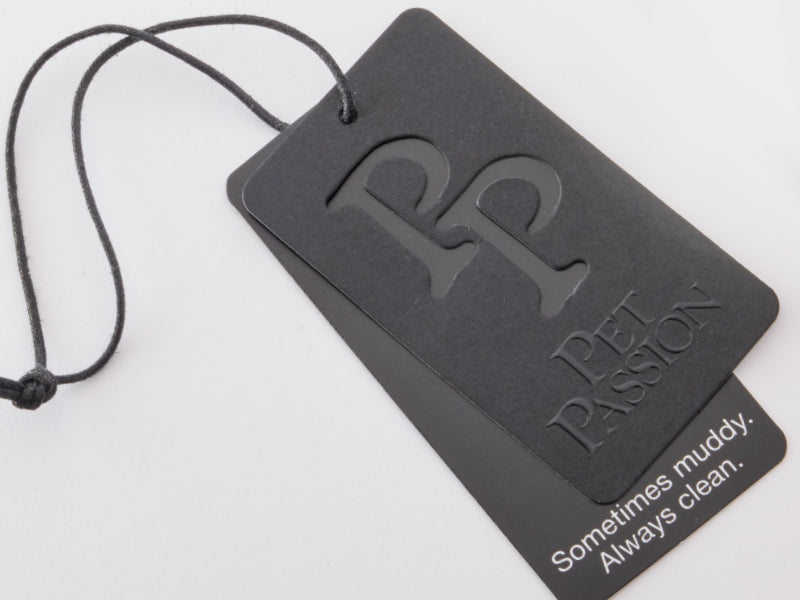 Black pet tag with 'Pet Passion' branding and text on a white background