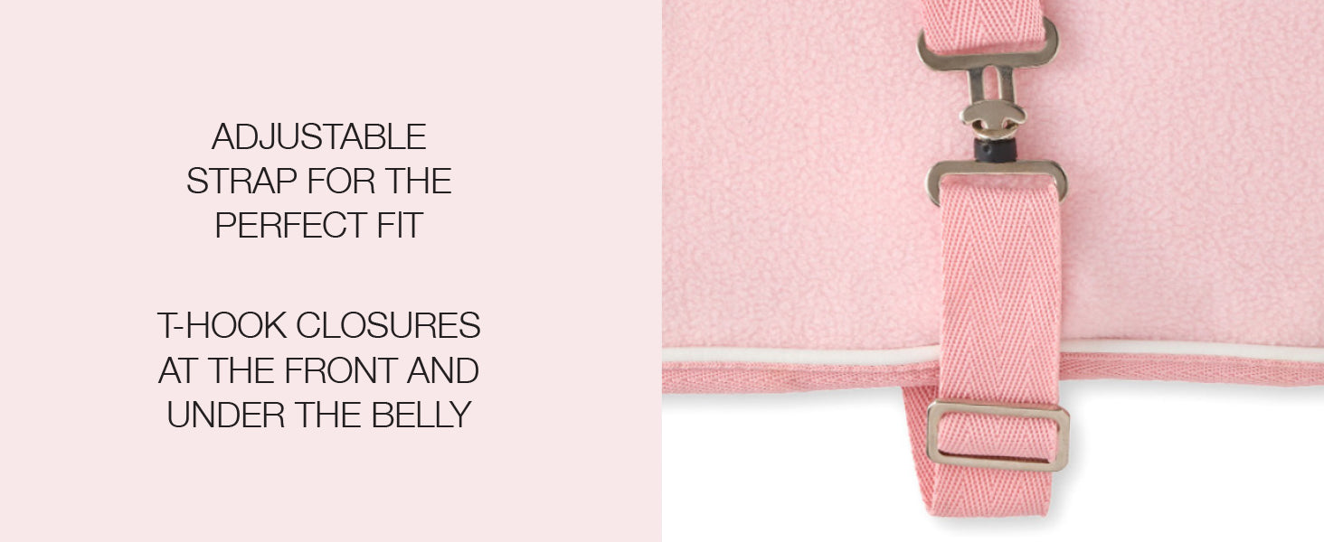 Pink pet coat with adjustable strap and T-hook closures on a white background
