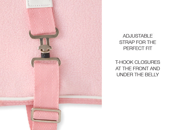 Close-up of a pink strap with T-hook closures on a white background
