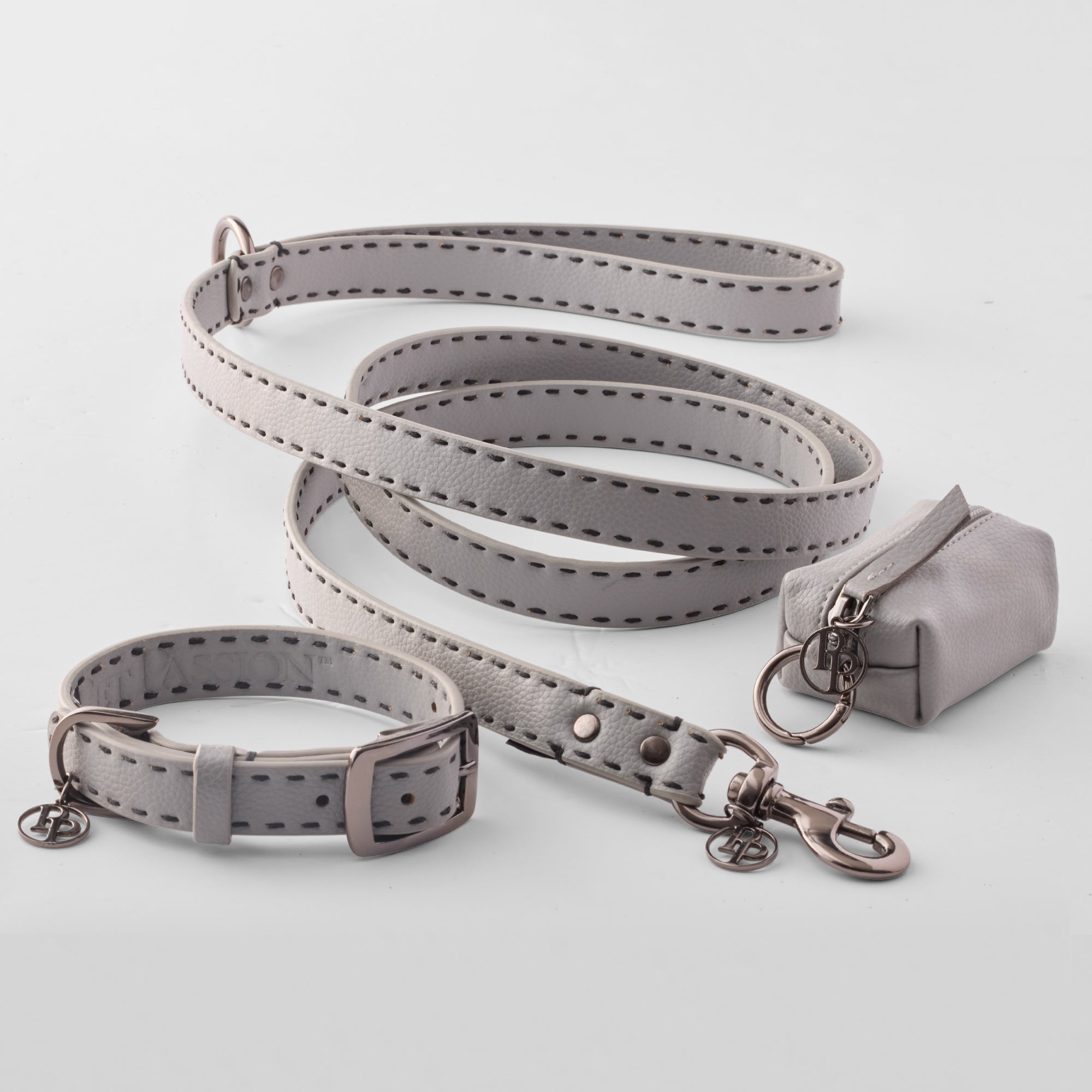 Layout of Rein collection including the Leash, Collar, and Caddy Bag in Gray
