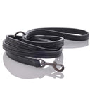 Black leather dog leash with metal clip on a white background