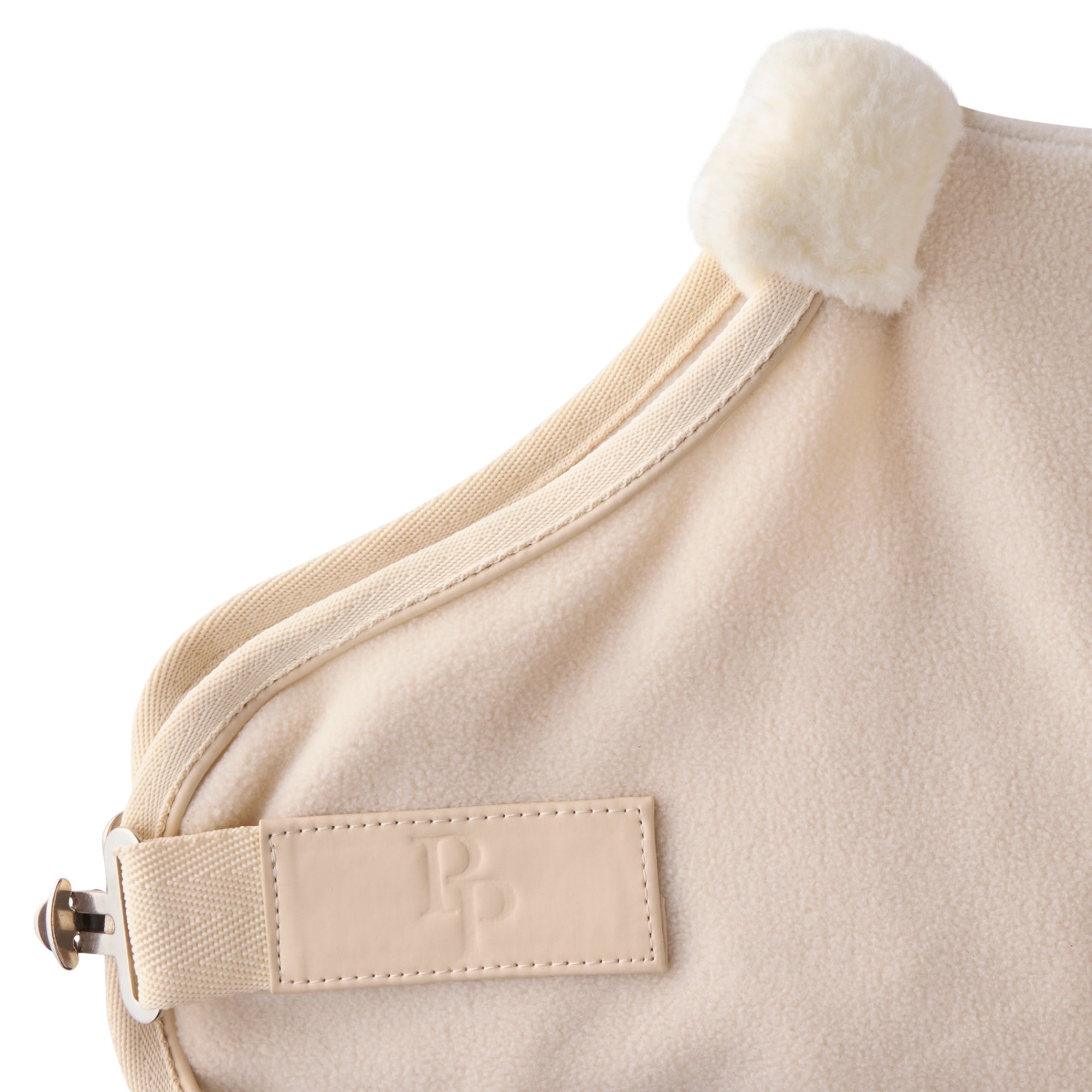 Zoom in of coat hardware and pet passion logo