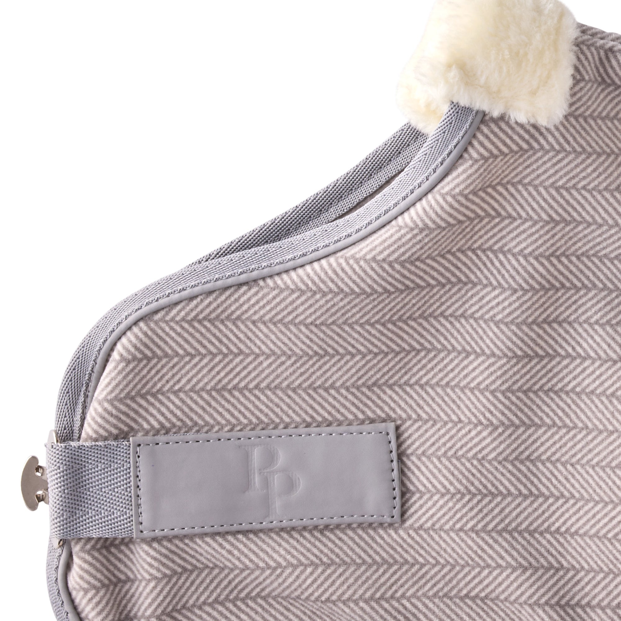 Zoom in of coat hardware and pet passion logo