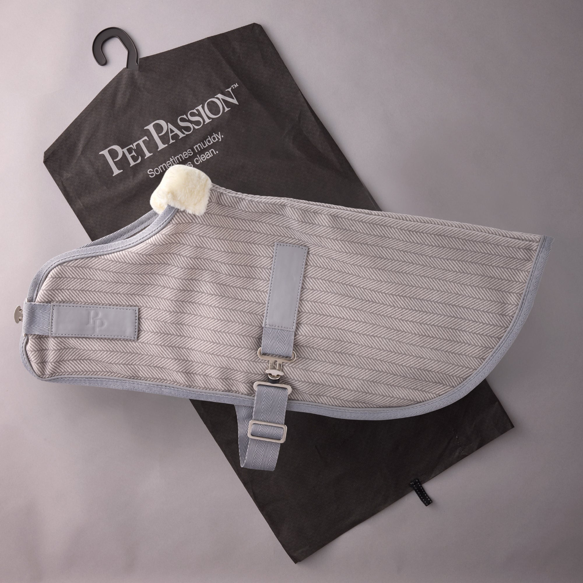 Pet passion dog coat on top of it's garment bag

