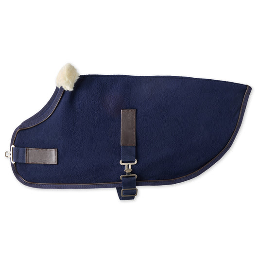 Navy blue dog coat with a white pom-pom on a white background