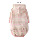 Pink and beige plaid dog coat on a white background