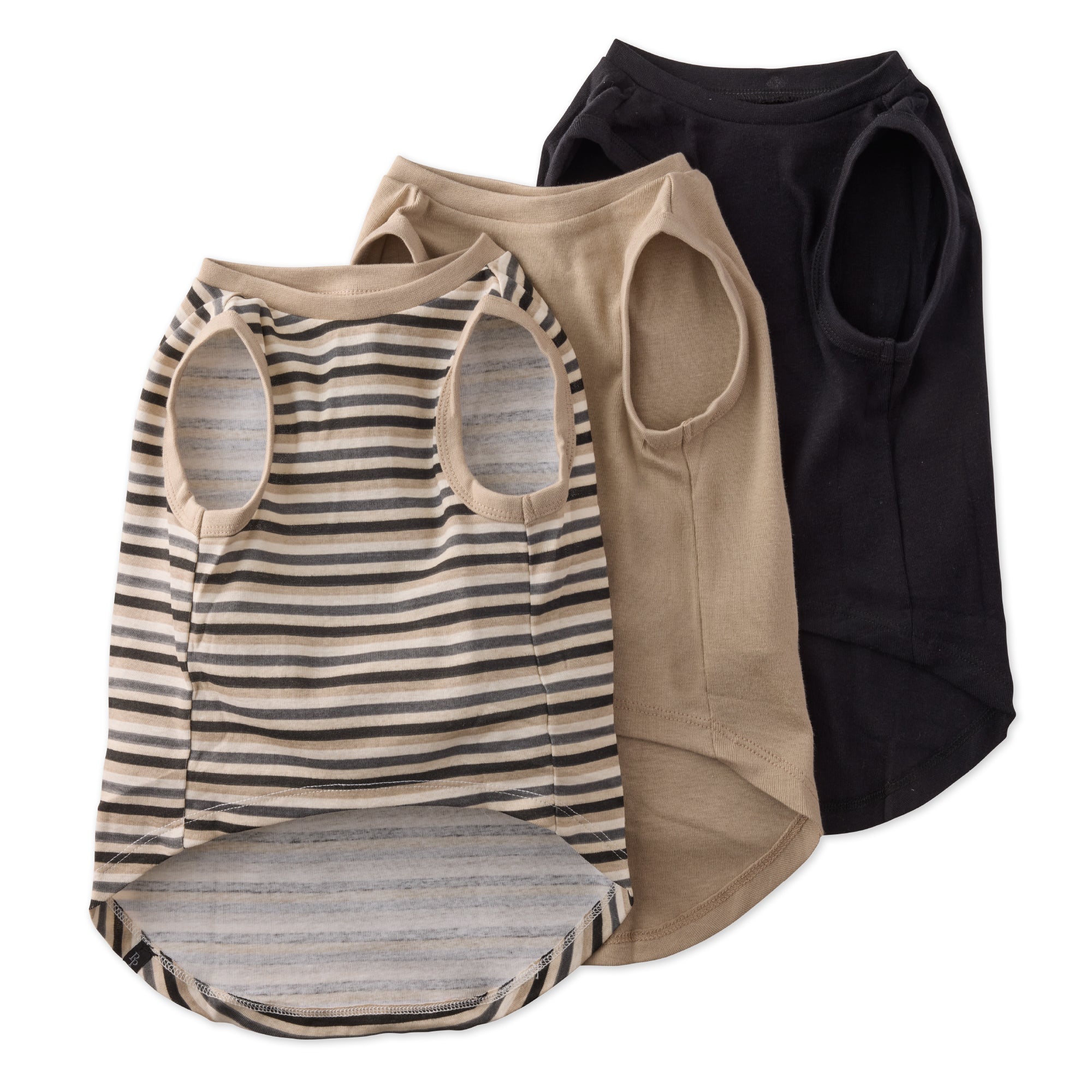 Four dog vests in different colors on a white background