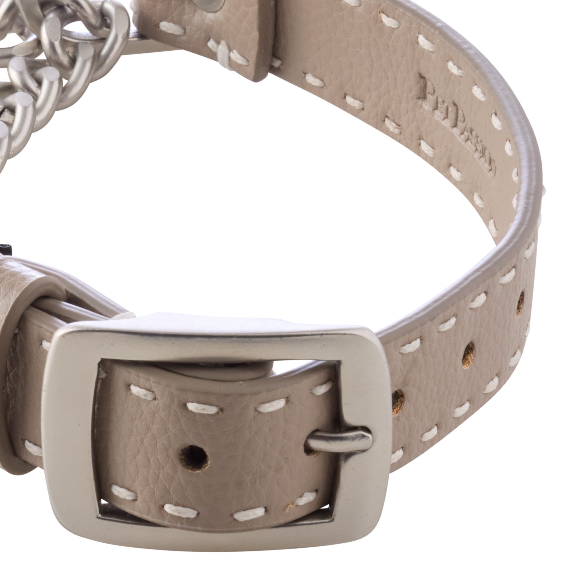 Close-up of collar buckle hardware and stitching. 