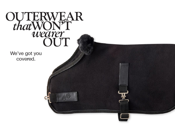 Black dog blanket with straps on a white background, featuring text 'Outerwear that won't wear out'.