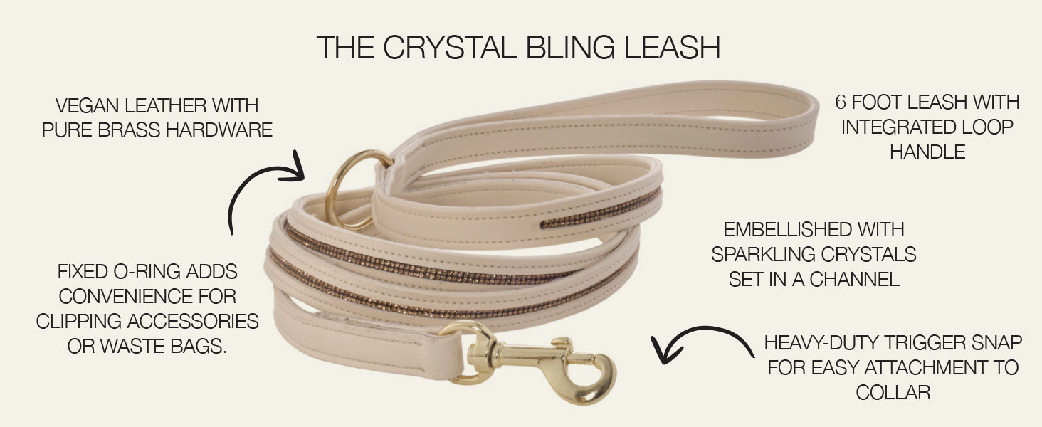 Beige dog leash with crystal embellishments and brass hardware on a white background